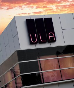 ULA Illuminated LED Building Sign at Sunset